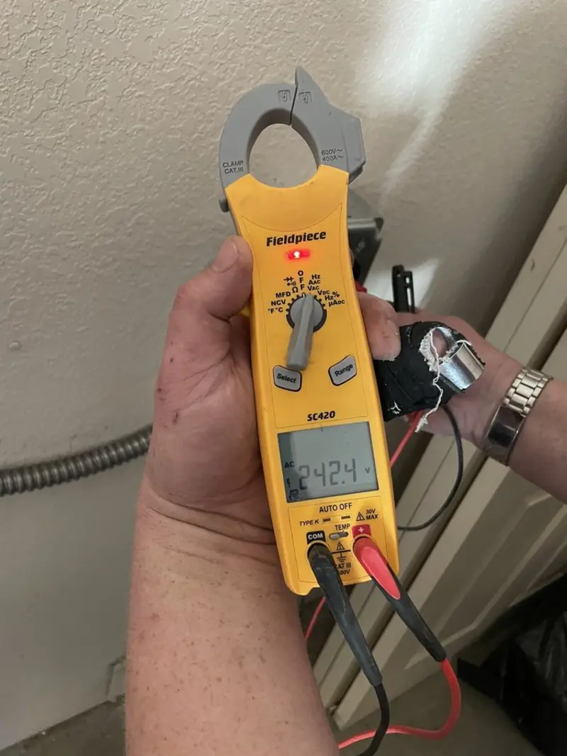 Voltage testing with clamp meter during Ceiling Fan Installation in Butner